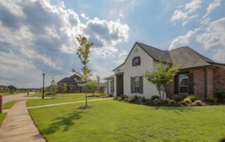Build to rent investing — a modern planned community with single-family rental homes and manicured landscaping